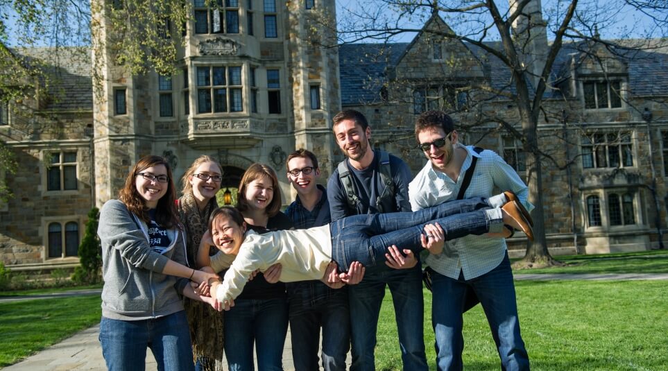 Group of Law Students outside in the Law Quad pose for a picture