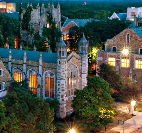 Arial view of quad at dusk with building lights glowing.
