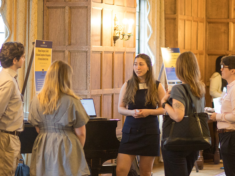 Michigan Law Student Ari Calem speaking with attendees.