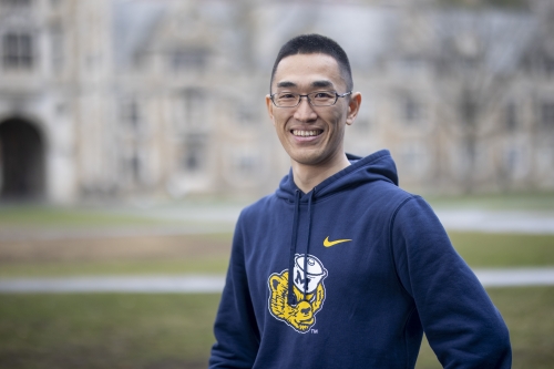 Takuji Shimizu stands in the Michigan Law Quad.