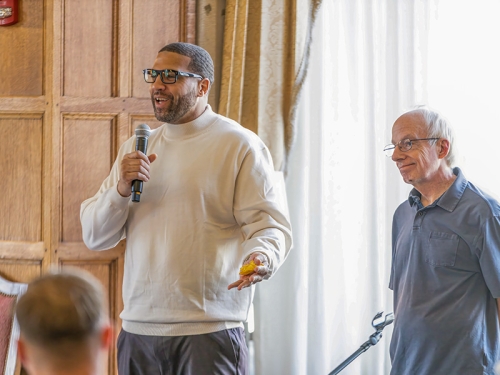 Professor Dave Moran and Client LaVone Hill speaking to a group.