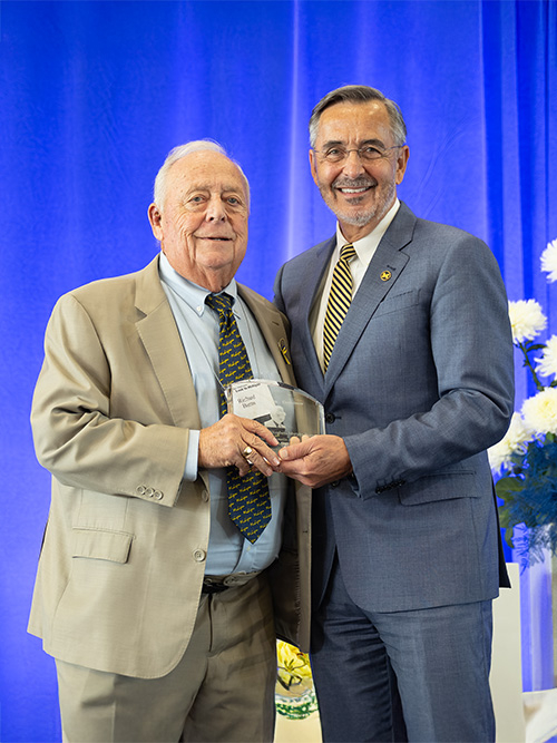 Richard Burns, ’71, presented with the David B. Hermelin Award for Fundraising Volunteer Leadership by the University of Michigan Interim President Domenico GrassoRichard Burns, ’71, presented with the David B. Hermelin Award for Fundraising Volunteer Leadership by the University of Michigan Interim President Domenico Grasso.