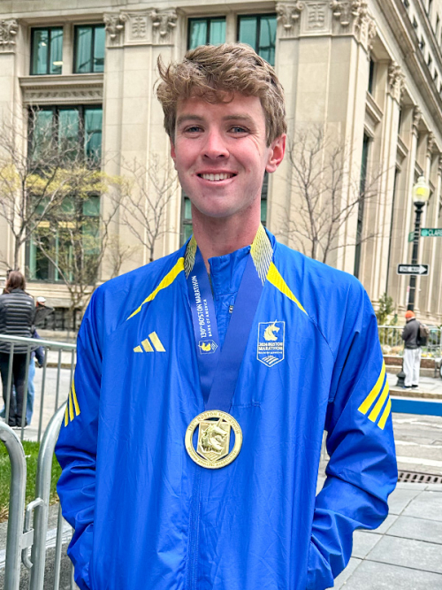 Andrew Healey wearing a 2026 Boston Marathon finisher's medal.