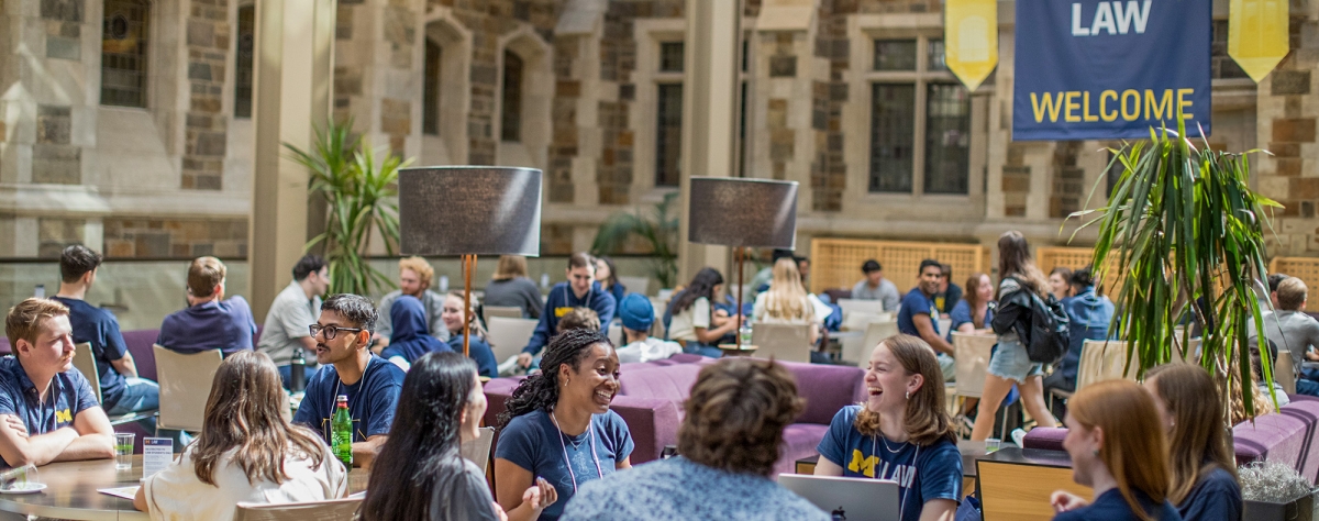 A group of Michigan Law students sitting together in the upper commons.