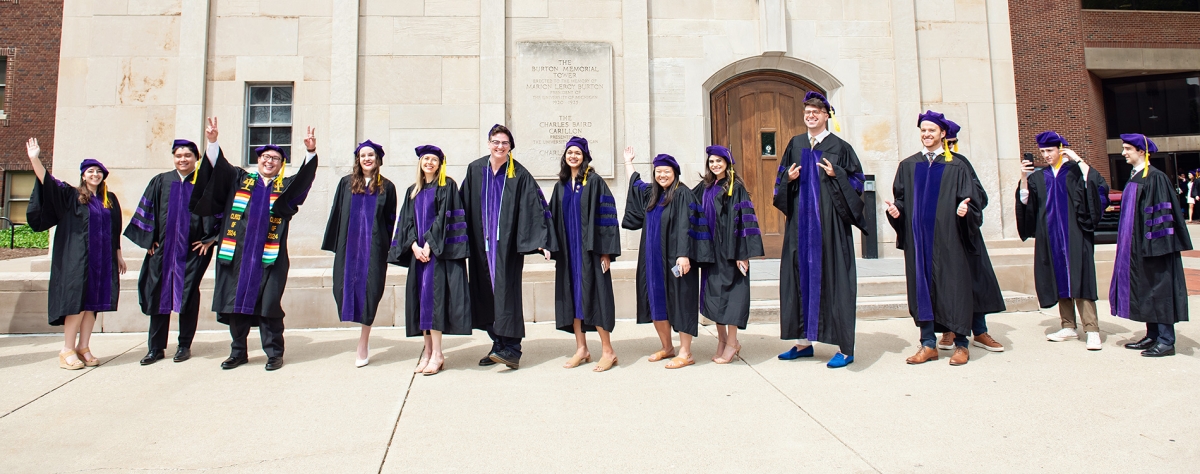 A group of Michigan Law students waiting outside for graduation.