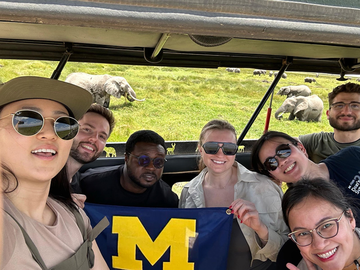 Al-Kubaisi and Peterson with IIF members on safari