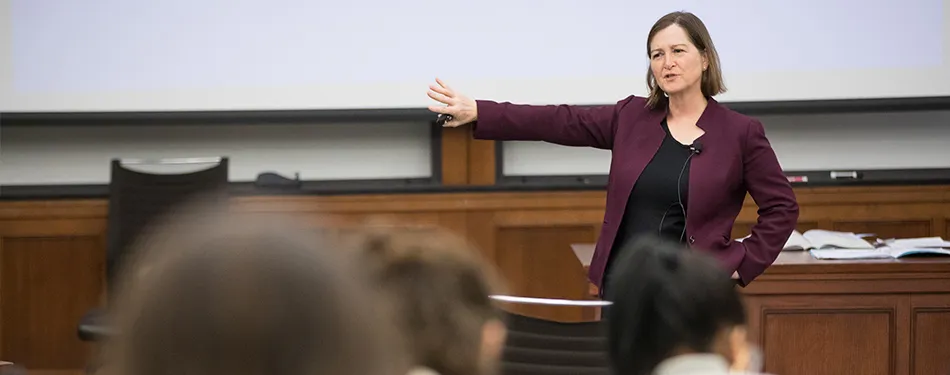 Barbara McQuade teaching in front of a classroom full of students