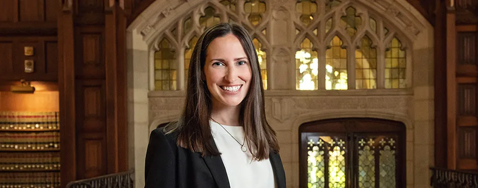 Professor Kristin Wolff standing in the Michigan Law Reading Room