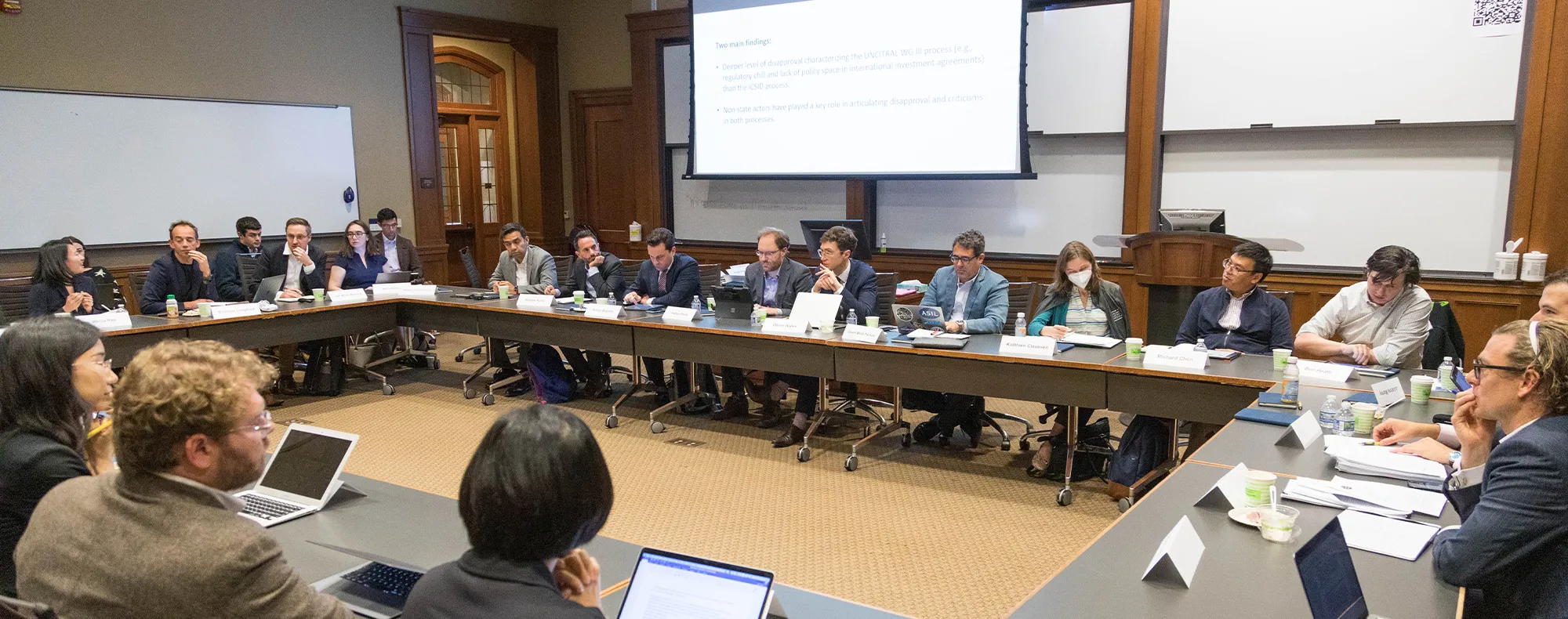 Many people listening to a lecture in the conference room