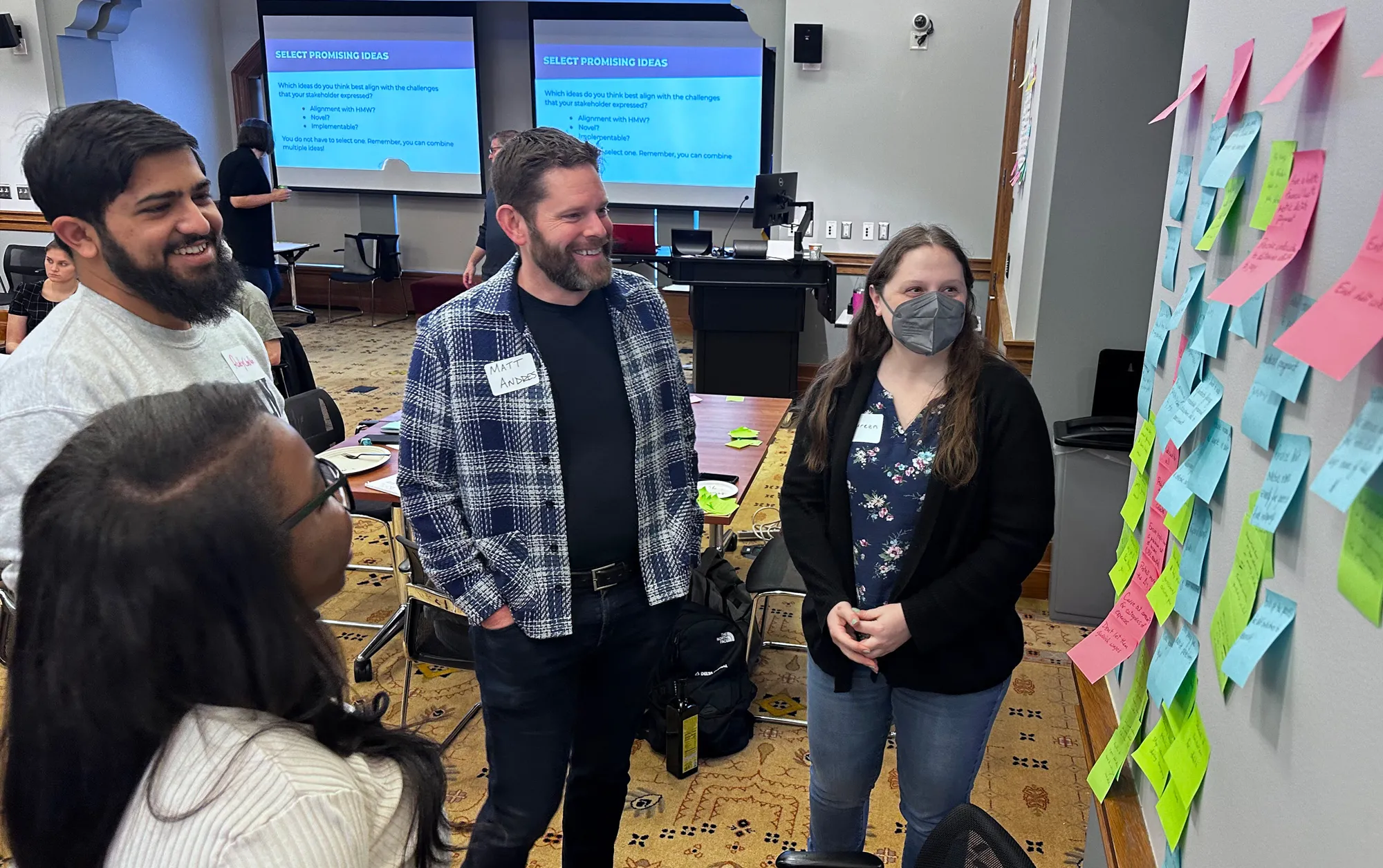 People reviewing a brainstorming session as part of a workshop
