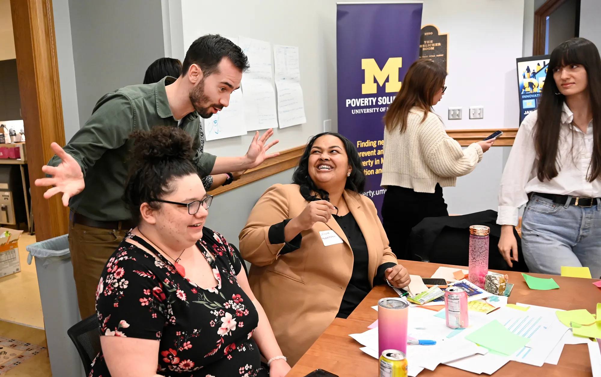 People excitedly, talking at a workshop