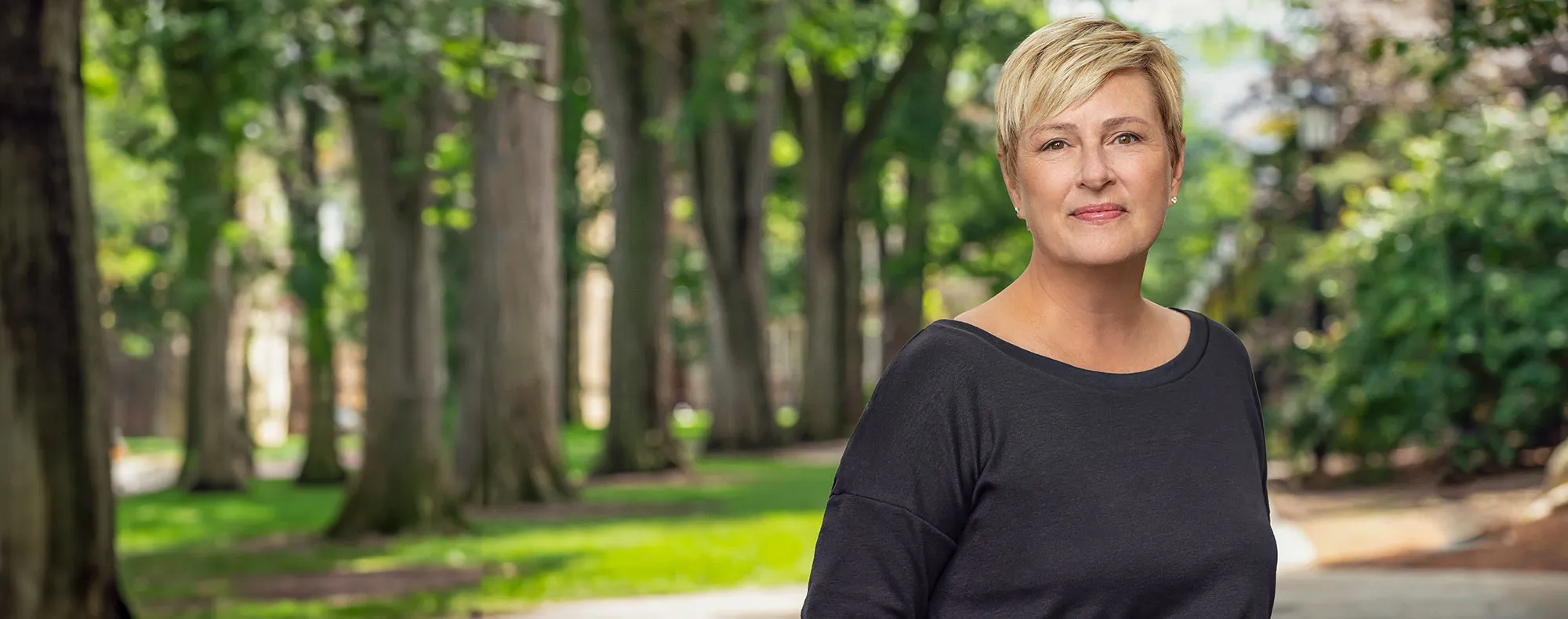A portait of Mary Buikema standing outside in the Law Quadrangle.