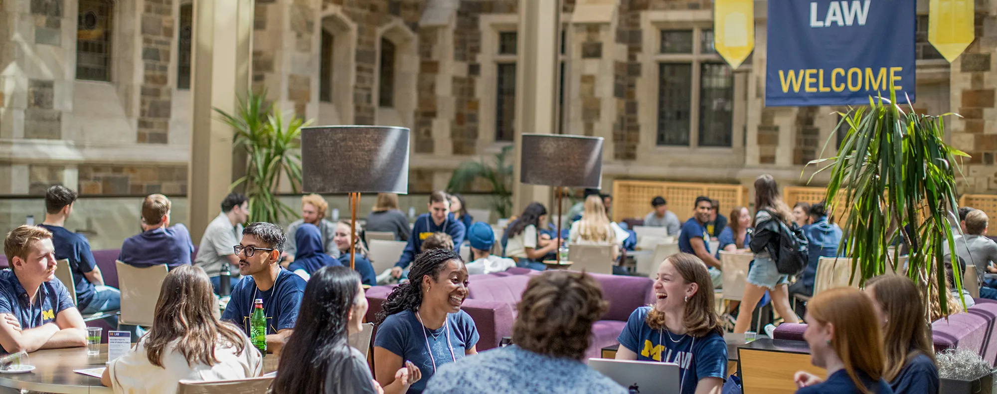 A group of Michigan Law students sitting together in the upper commons.