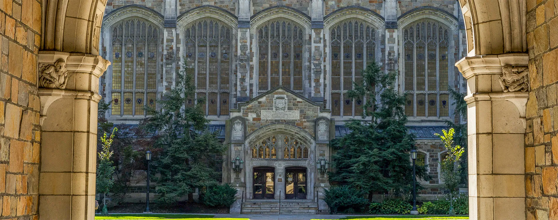 Exterior view of the Reading Room entrance from the Law Quad through a Lawyer's Club archway.