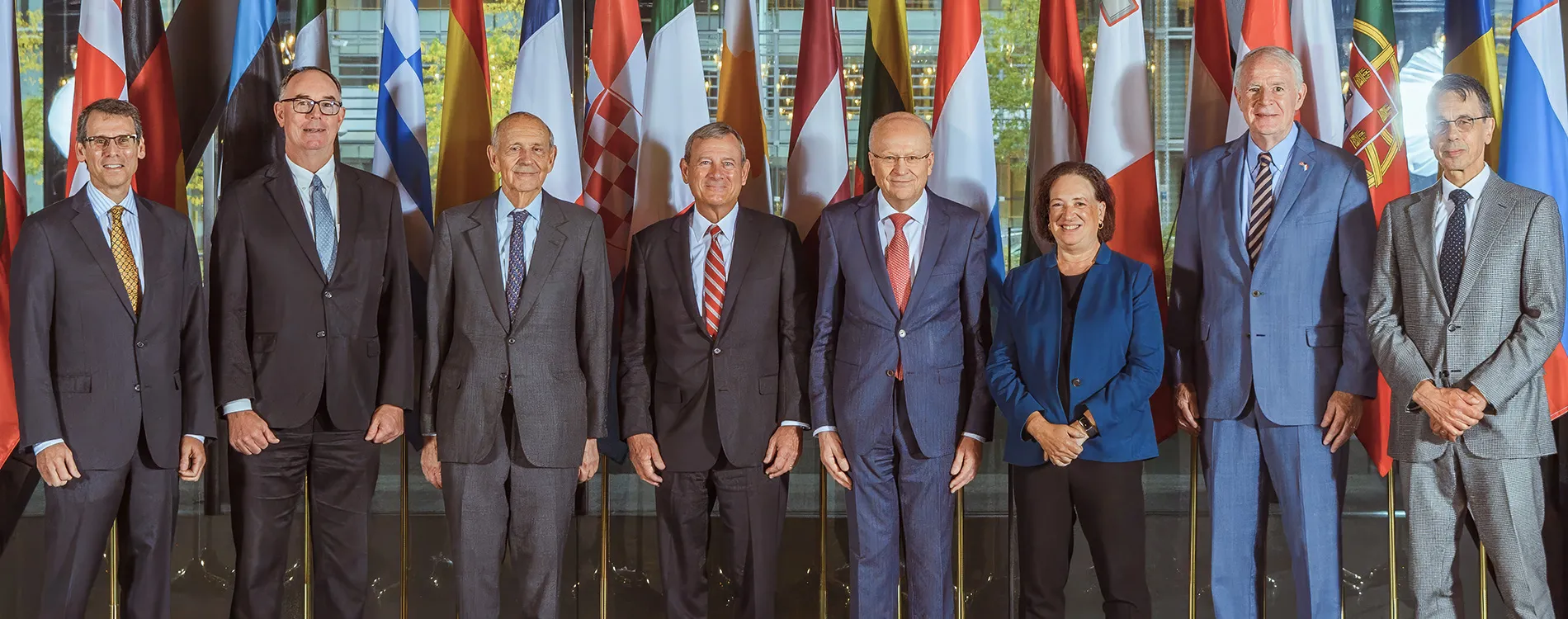Michigan Law Professor Daniel Halberstam standing next to the US Supreme Court delegation to the Court of Justice of the European Union.