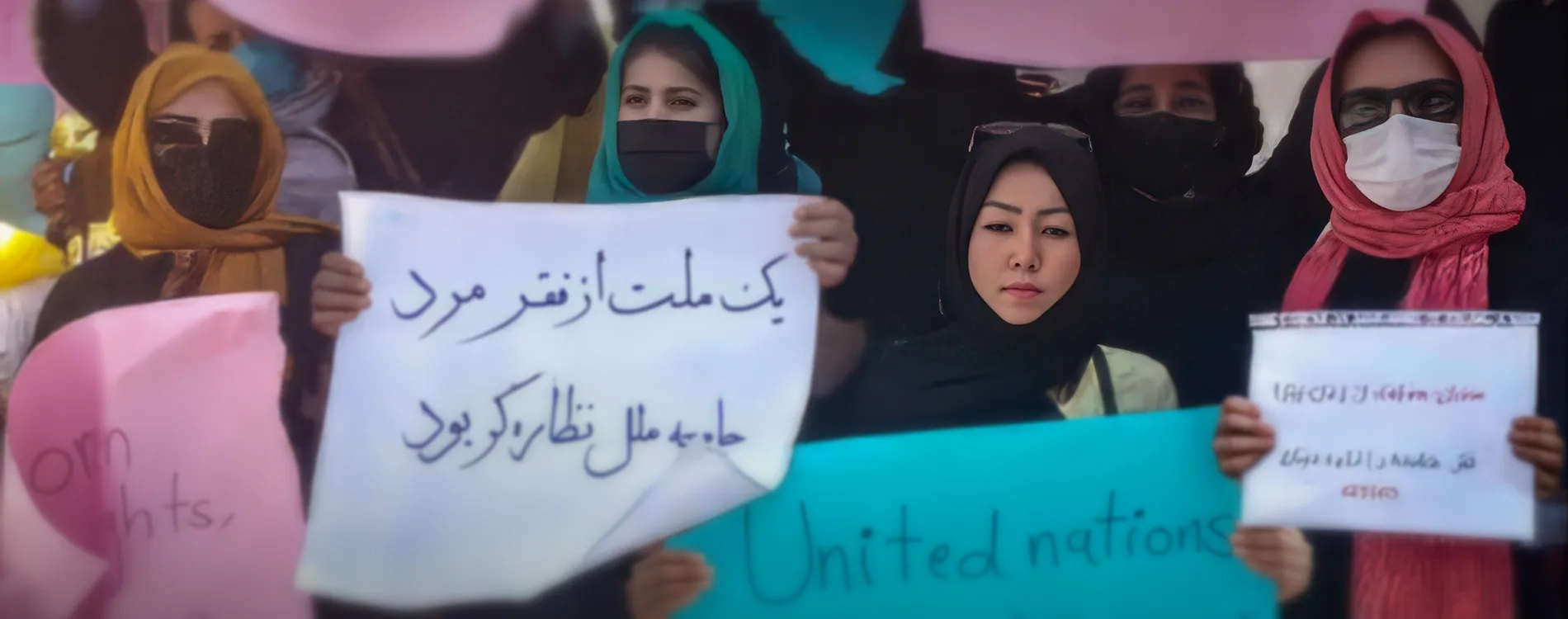 A group of women holding protest signs.