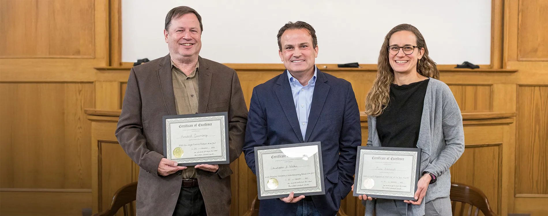A portrait of Howard Bromberg, Christopher Walker, and Mira Edmonds holding their teaching awards.