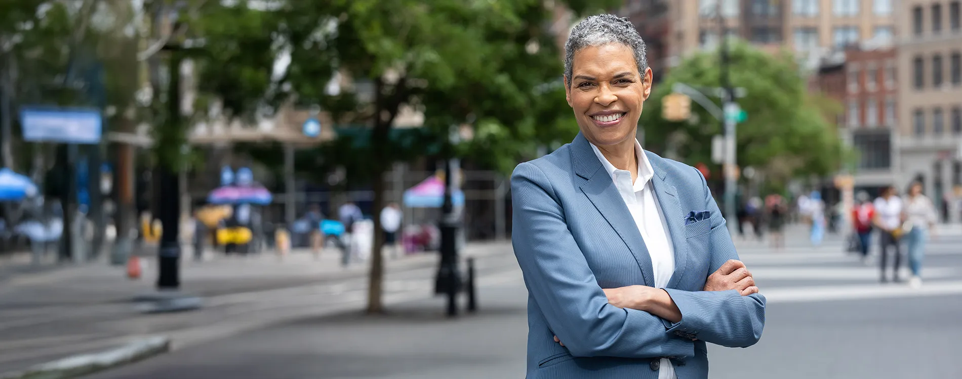 Michelle Adams portrait with a cityscape in the background.