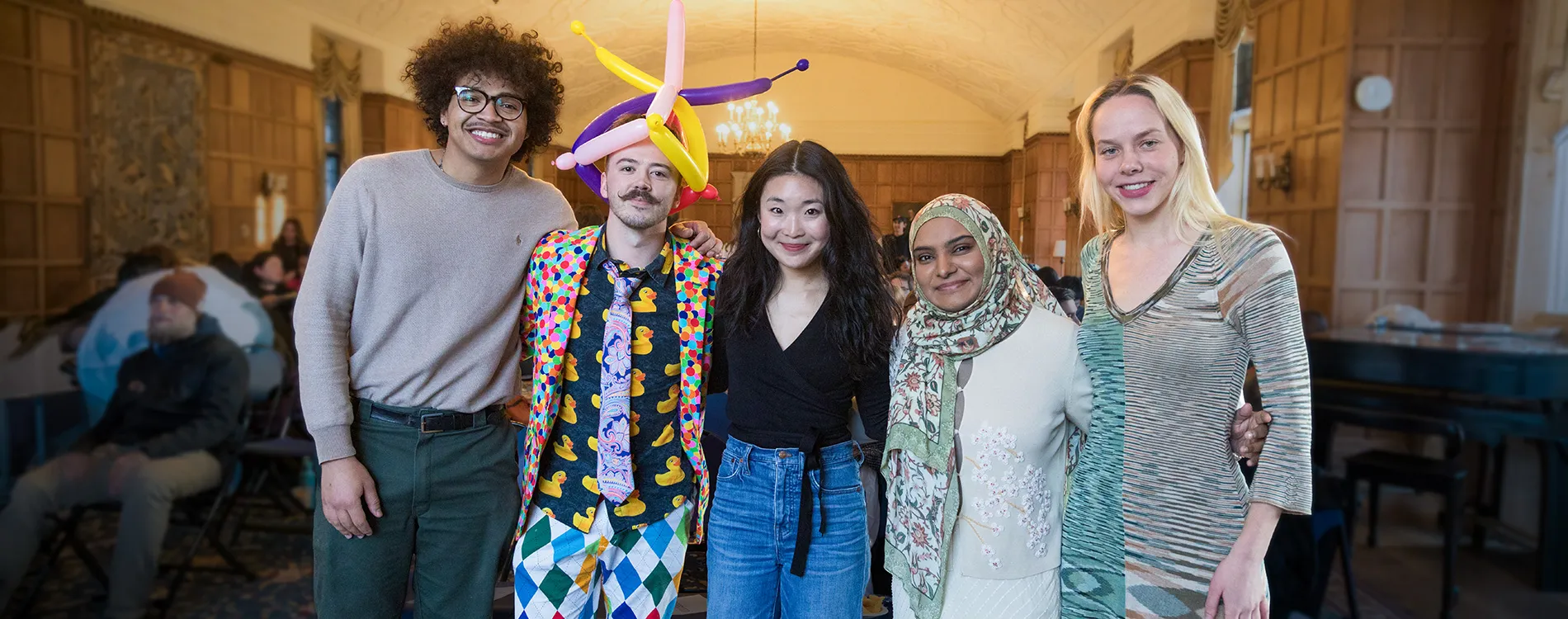 Brad Gonzalez, Noah Rotroff, Jennifer Jiwon Kim, Raisa Faatimah, and Isabel Bysiewicz gather together at the Michigan Law public interest storytelling event, The Valiant.