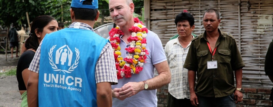 James Hathaway talks with local village in Nepal 