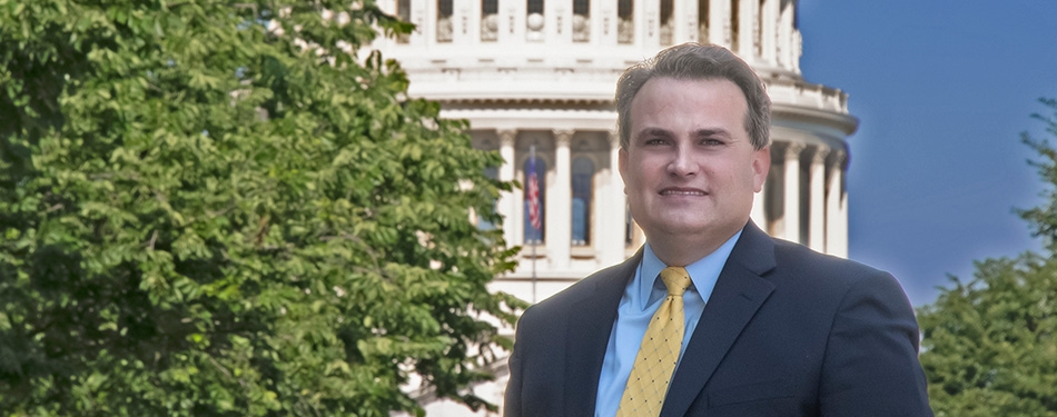 Professor Chris Walker with the U.S. capital in the background