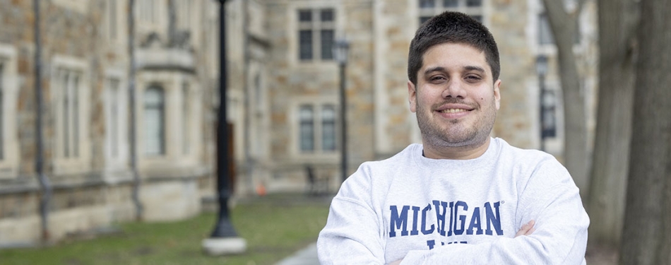 René Figueredo Corrales stands in the Michigan Law Quad.