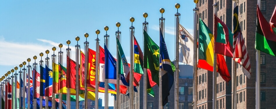 a group of flags on poles
