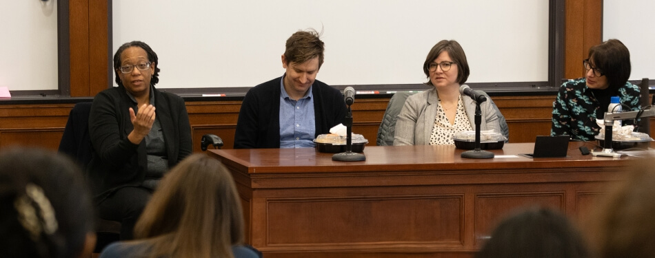 Four people sitting on a panel for the public interest week at University of Michigan Michigan law school.