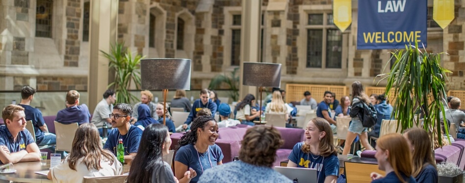 A group of Michigan Law students sitting together in the upper commons.