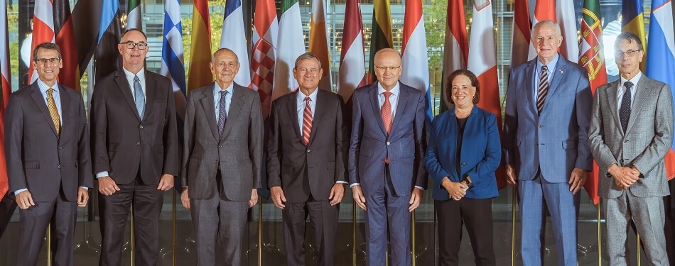 Michigan Law Professor Daniel Halberstam standing next to the US Supreme Court delegation to the Court of Justice of the European Union.