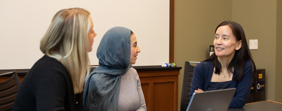 Professor Juliana Lee working with students