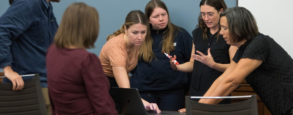 Professor Bridgette Carr teaching students in a classroom