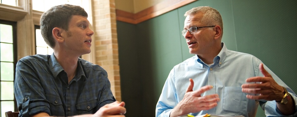 Professor Frank Vandervort working with a student