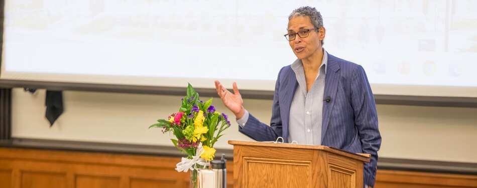 Michelle Adams speaking at a Michigan Law Blue Jeans lecture.