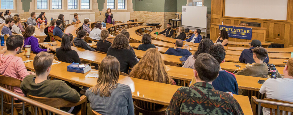 Eve Brensike Primus leads a discussion with Michigan Law students and alumni during a MDefender meeting.