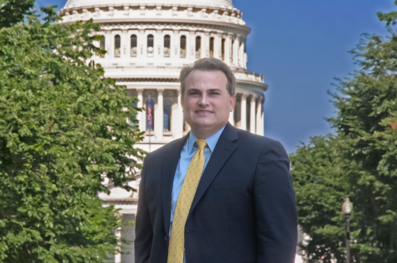 Professor Chris Walker with the U.S. capital in the background