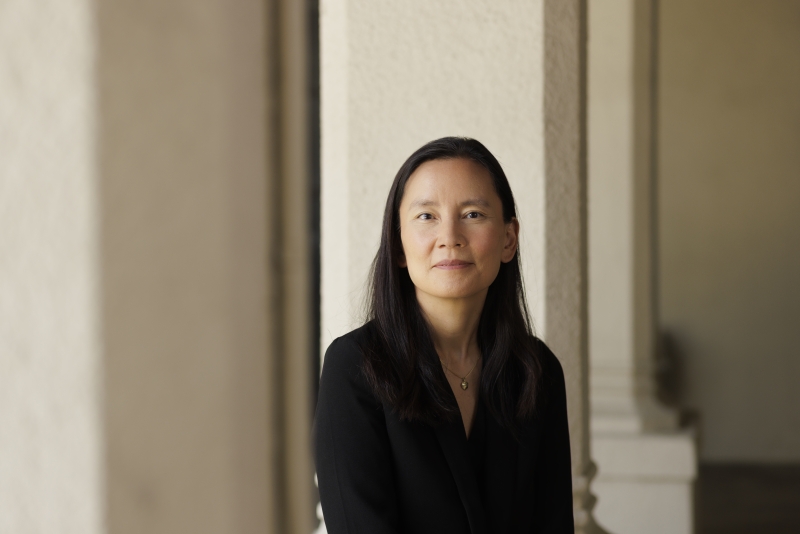 Professor Julianna Lee with blurry columns in the background