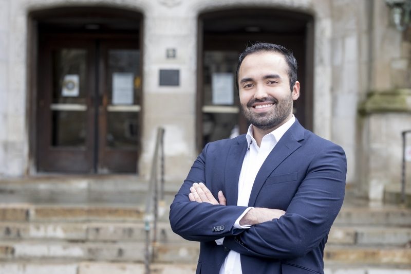 Luis Diaz stands in front of Hutchins Hall.