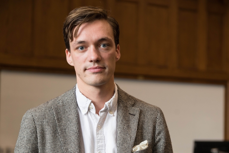 Philipp Kraemer stands in front of a marker board in a Michigan Law classroom.