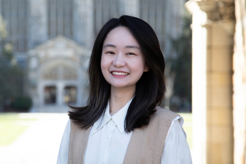 Xinyi Li smiles in the sunny Law Quad.