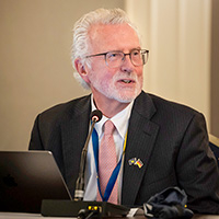 Christopher McCrudden participates in a speaker panel at the European Alumni Reunion in Berlin.
