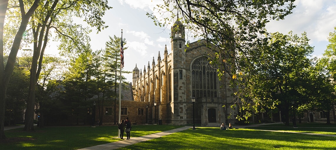 View of the dining hall from the Law quad courtyard with early morning light.