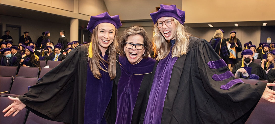 Dean Zearfoss celebrating with law students at graduation 