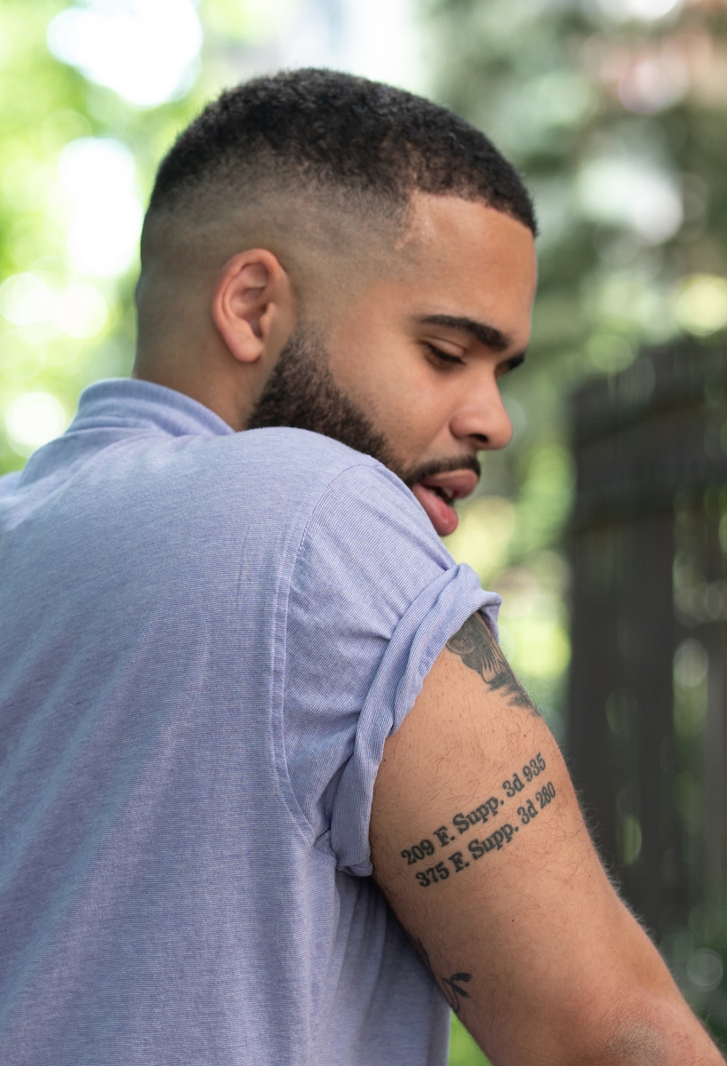 Christopher Knight shows a tattoo of a case citation on his upper arm.
