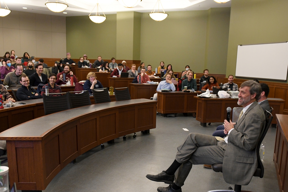 Filled lecture hall where student Laughing and having a nice time during a lecture