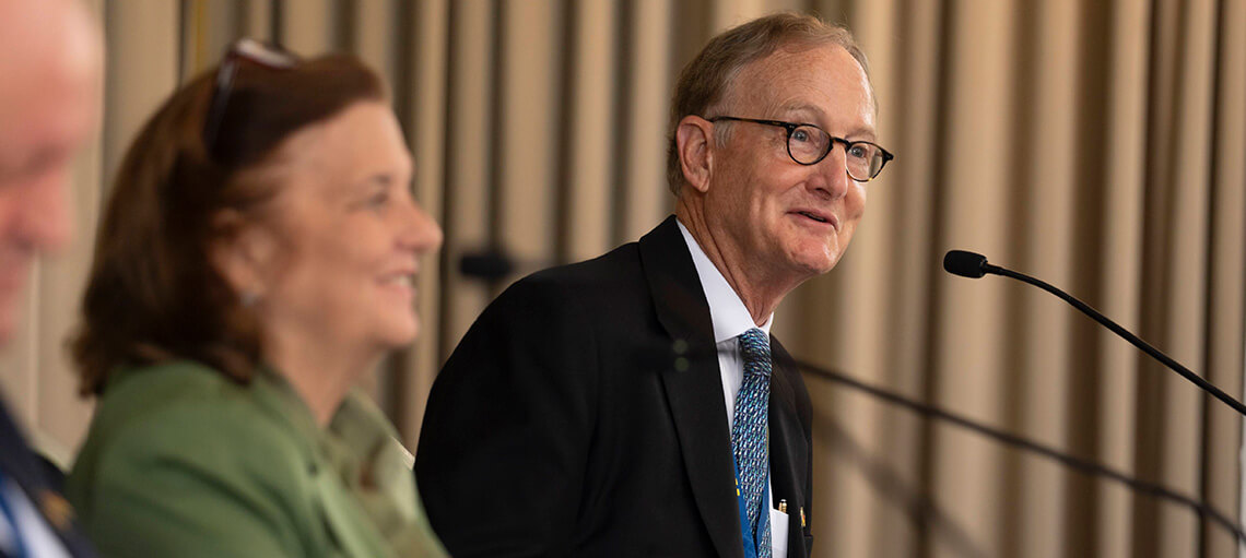 Timothy L. Dickinson moderating a panel discussion at the European Alumni Reunion.