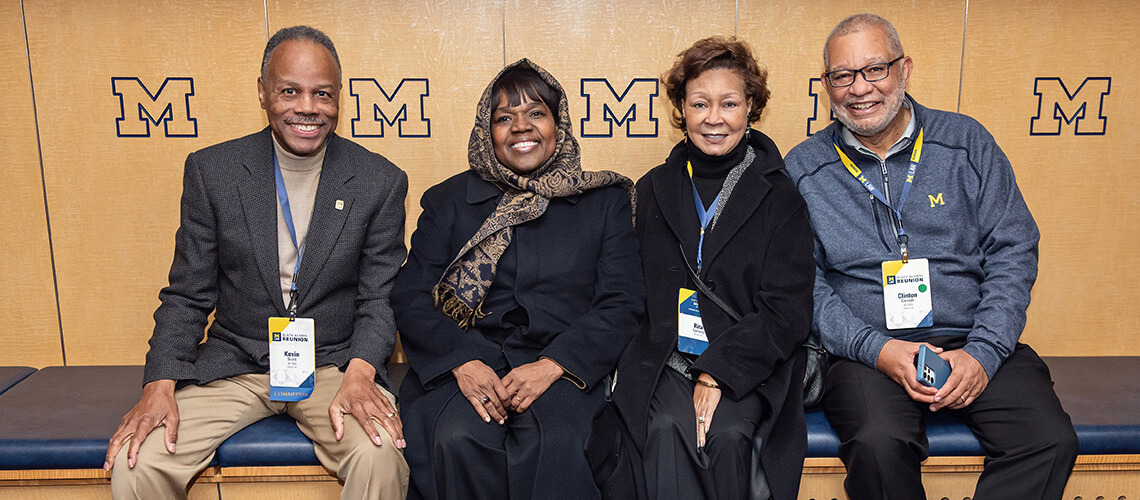 Kevin Scott and partner with Rita and Clinton Canady in the Michigan Stadium Locker Room.