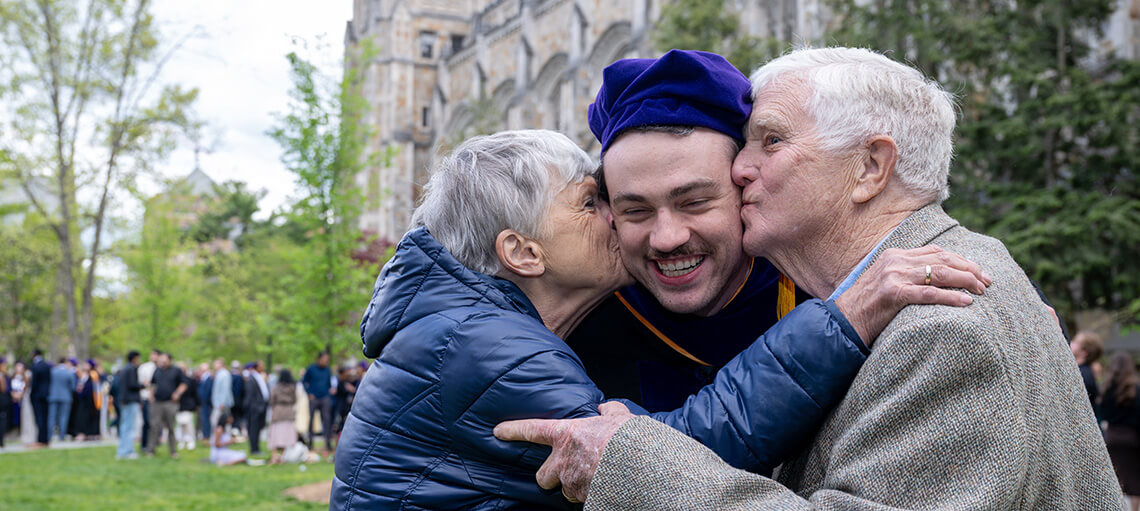 Michigan Law Student receives kisses from family.