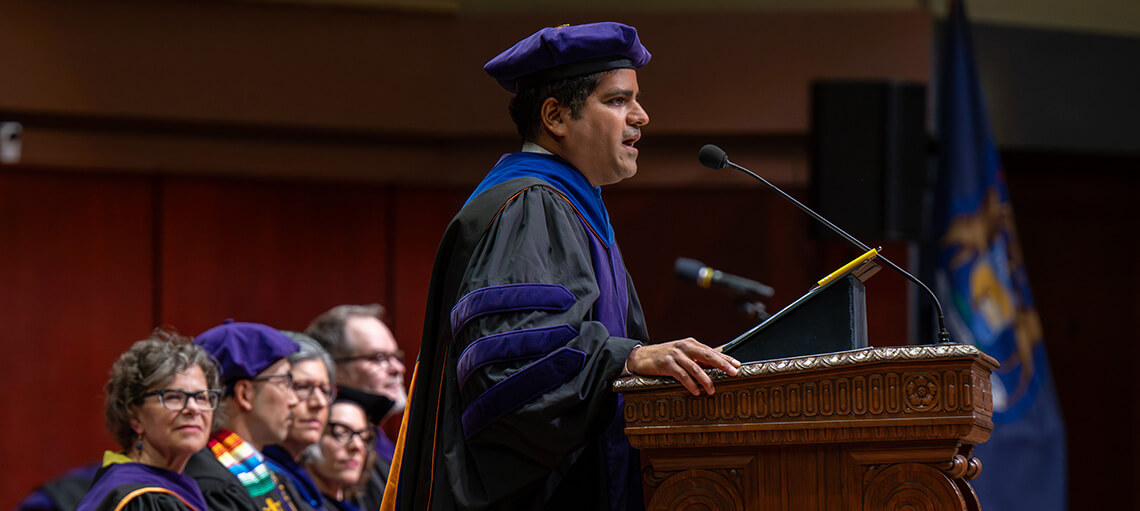 Neel Sukhatme addresses audience during Senior Day Ceremony.