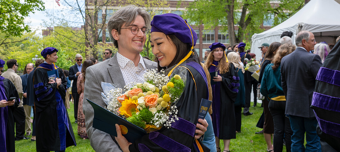 Michigan Law student receives a hug from partner.